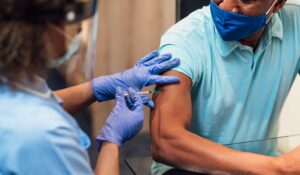 Third Vaccine Shown as Key to Preventing Hospitalization from COVID-19 Variant